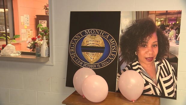 A photo of Monica Mosley with some balloons is seen on display at the event 