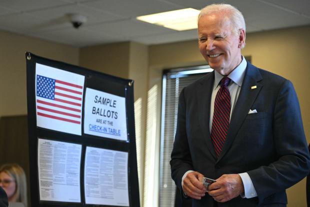 President Biden waits in line inside a polling station in New Castle, Delaware, Oct. 28, 2024. 