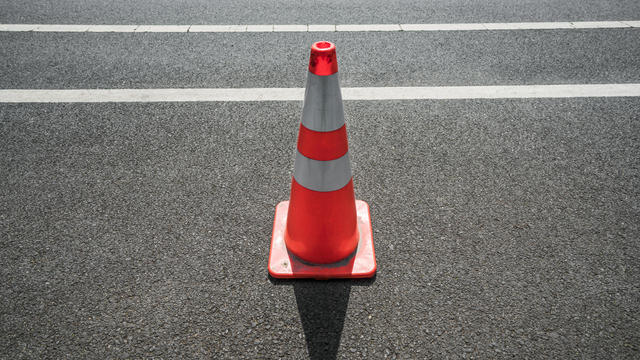 Traffic cone,an image of cautions on asphalt road 