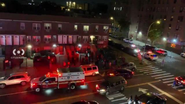 Emergency vehicles seen outside a row of homes in the Bronx. 