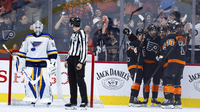 Philadelphia Flyers' Garnet Hathaway celebrates his goal with teammates on the ice 