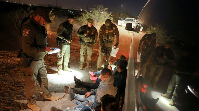 Migrants are detained by U.S. Border Patrol agents in New Mexico