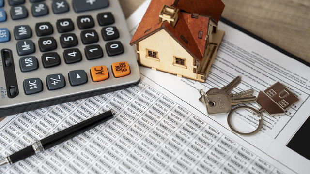 Money, pile coin with saving book and paper home,concept 