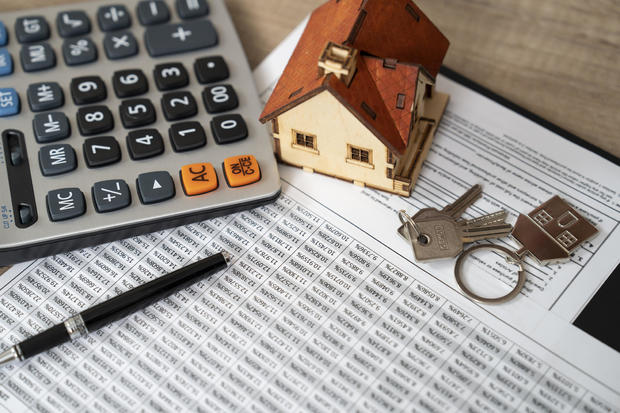 Money, pile coin with saving book and paper home,concept 