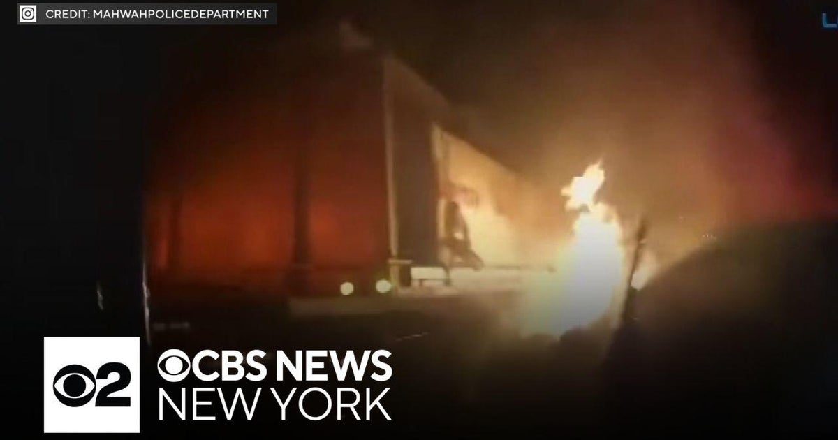 Videos show N.J. police officers rescue driver from fiery crash - CBS ...