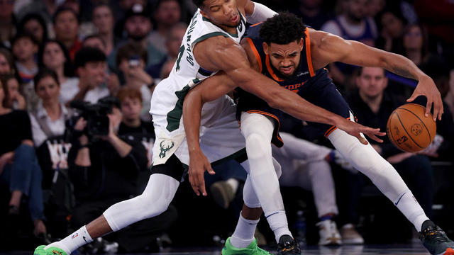 Karl-Anthony Towns #32 of the New York Knicks heads for the net as Giannis Antetokounmpo #34 of the Milwaukee Bucks defends in the first half at Madison Square Garden on November 08, 2024 in New York City. 