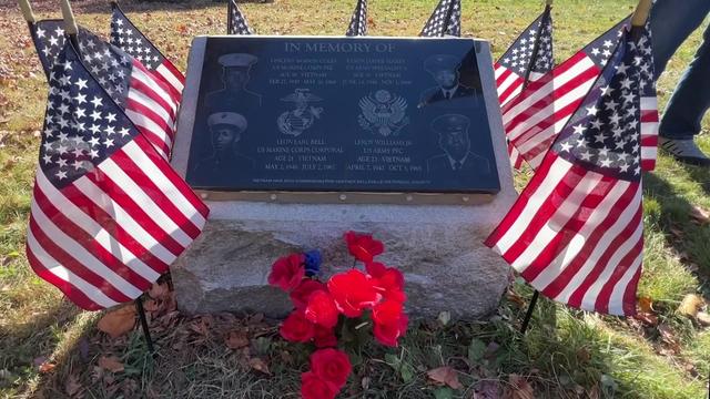 A plaque at Woodland Cemetery honors Marines Vincent Samson Coles and Leon Earl Bell, alongside Eason Jasper Maxey and Leroy Williams Jr. of the United States Army. 