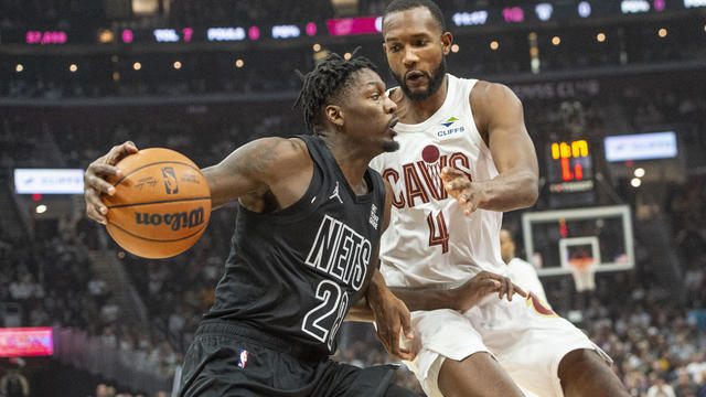 Brooklyn Nets' Dorian Finney-Smith (28) drives against Cleveland Cavaliers' Evan Mobley (4) during the first half of an NBA basketball game in Cleveland, Saturday, Nov. 9, 2024. 