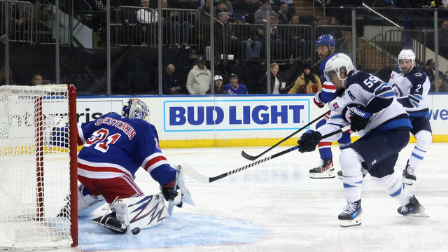 Mark Scheifele #55 of the Winnipeg Jets scores a third period goal against Igor Shesterkin #31 of the New York Rangers at Madison Square Garden on November 12, 2024 in New York City. 