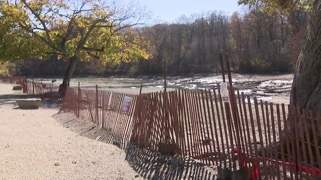 A fence blocks off what once was Mill Pond. 