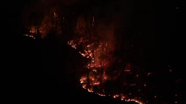 Firefighters knock down a hotspot at the Greenwood Lake fire on November 15, 2024 in Greenwood Lake, New York. 