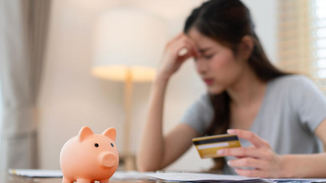 Woman Stressing Over Finances at Home 