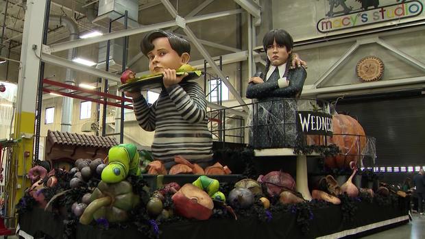 A Macy's Thanksgiving Day Parade float featuring the characters of Pugsley Addams, Wednesday Addams and Thing. 