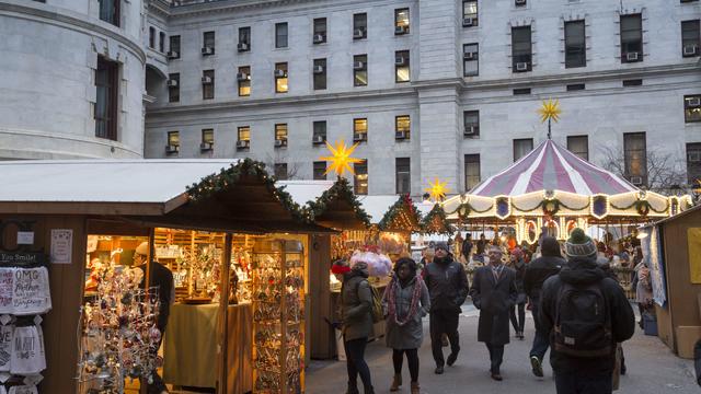 People walk through the Christmas Village near City Hall in Philadelphia 