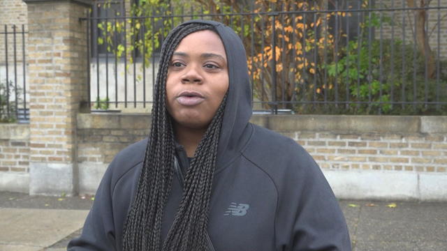 Classroom assistant Rasheima Hainey speaks outside the school 