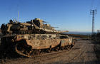 An Israeli tank maneuvers, amid cross-border hostilities between Hezbollah and Israel, by Israel's border with Lebanon 