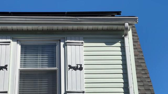 Solar panels on top of the roof of a home. 