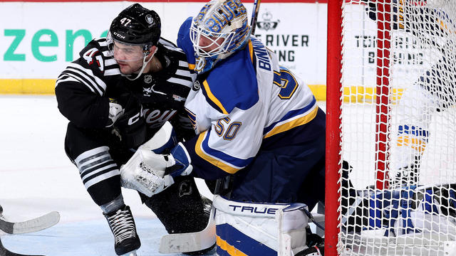 Paul Cotter #47 of the New Jersey Devils collides with Jordan Binnington #50 of the St. Louis Blues during the second period at Prudential Center on November 27, 2024 in Newark, New Jersey. 