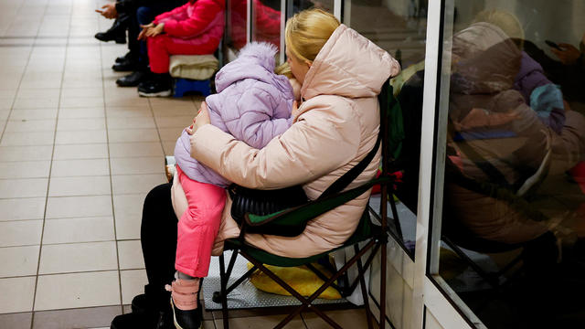 People take shelter inside a metro station during a Russian military attack, in Kyiv 