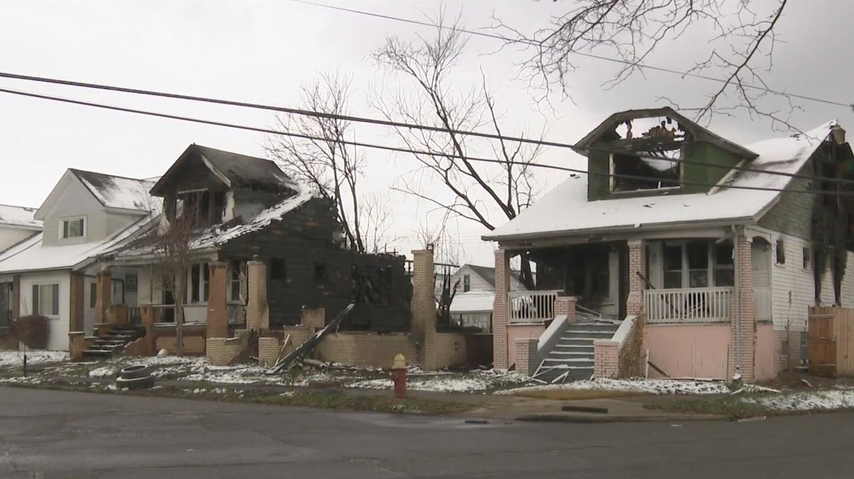 Woman displaced after large fire burns through multiple homes on ...