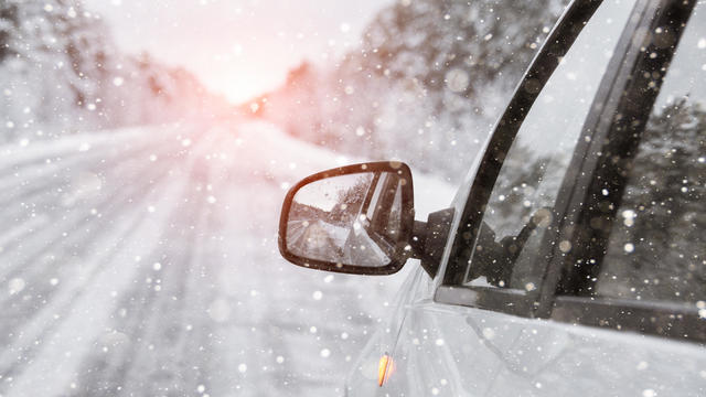 The winter road with car 