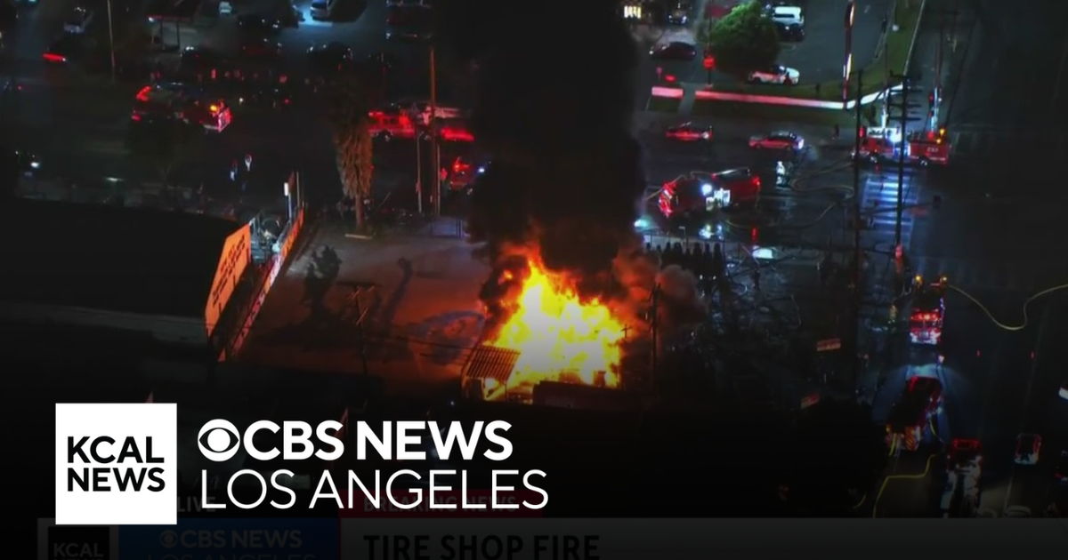 Massive fire rips through South LA tire shop - CBS Los Angeles
