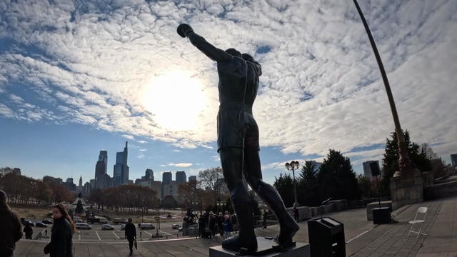 The Philadelphia skyline is seen behind the Rocky statue at the top of the Art Museum steps 