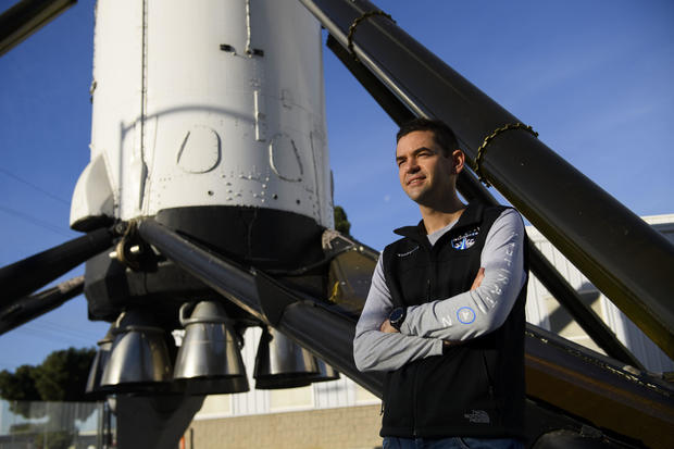 Inspiration4 mission commander Jared Isaacman, founder and chief executive officer of Shift4 Payments, stands for a portrait in front of the recovered first stage of a Falcon 9 rocket at SpaceX on Feb. 2, 2021, in Hawthorne, California. 