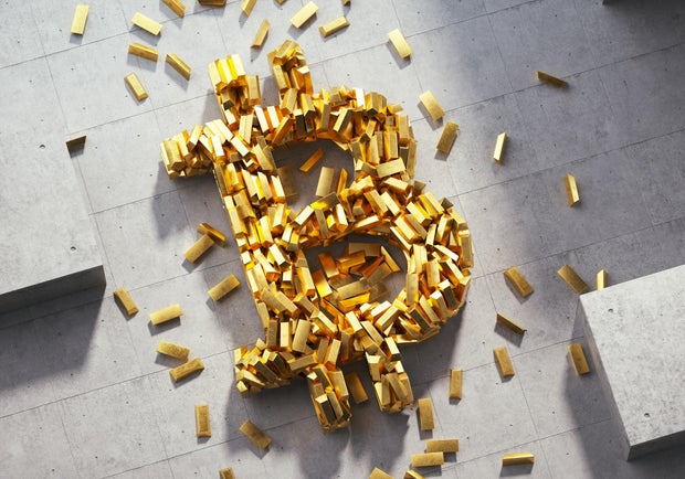 Bitcoin sign made out of golden bars