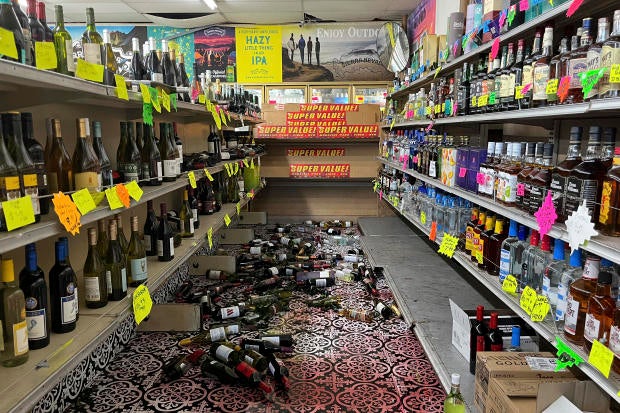 Broken bottles are scattered on the floor inside E&J Liquors after a 7.0 magnitude earthquake, Dec. 5, 2024, in Rio Dell, California. 