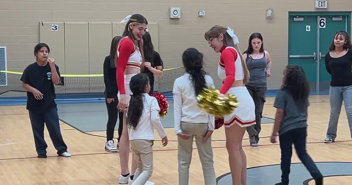 University of Denver Athletics Department cheer squad helps with ...