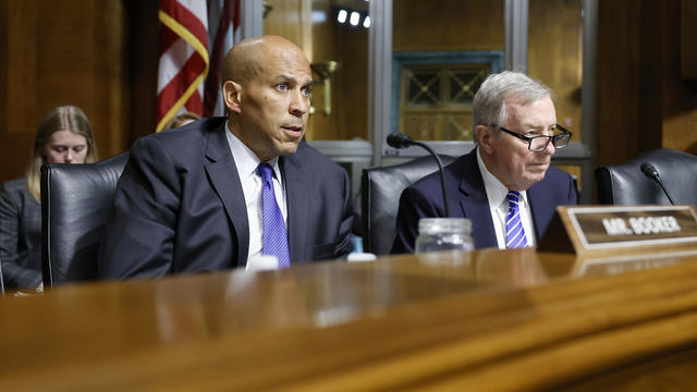 Sen. Cory Booker and Sen. Dick Durbin listen during a hearing with the Senate Judiciary subcommittee on Capitol Hill on June 12, 2024 in Washington, DC. 