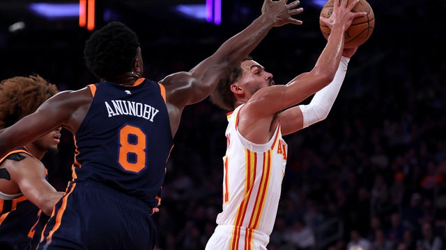 Trae Young #11 of the Atlanta Hawks heads for the net as OG Anunoby #8 of the New York Knicks defends during the first half of the quarterfinal game of the Emirates NBA Cup at Madison Square Garden on December 11, 2024 in New York City. 