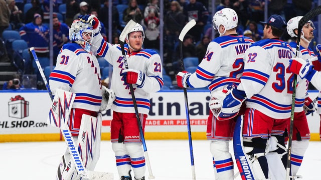 Igor Shesterkin #31, Adam Fox #23, Kaapo Kakko #24 and Jonathan Quick #32 of the New York Rangers celebrate their win after an NHL game against the Buffalo Sabres on December 11, 2024 at KeyBank Center in Buffalo, New York. 