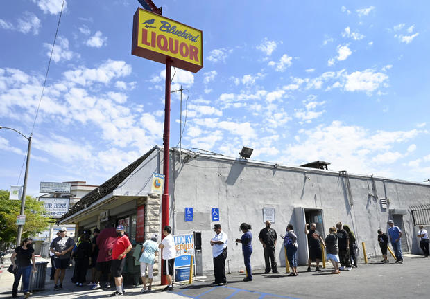 The line is long with people eager to win their share of the Mega Lotto $1.2billion drawing. 