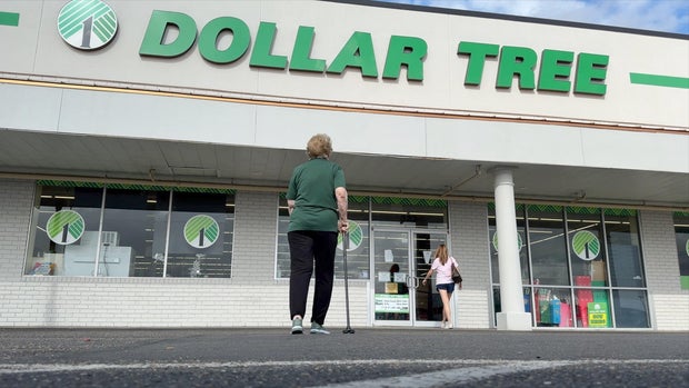 Evelyn walking into the Dollar Tree store where she works