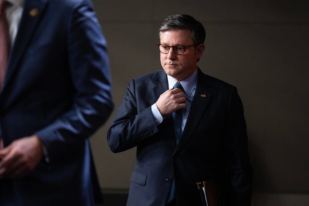Speaker of the House Mike Johnson arrives for a news conference in the Capitol Visitor Center after a meeting of the House Republican Conference on Tuesday, Dec. 17, 2024.