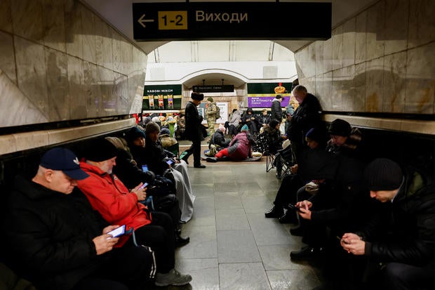 People take shelter at a metro station during an air raid alert, in Kyiv 