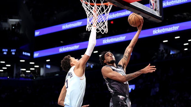 Nic Claxton #33 of the Brooklyn Nets shoots the ball as Victor Wembanyama #1 of the San Antonio Spurs defends during the second half at Barclays Center on December 27, 2024 in New York City. 