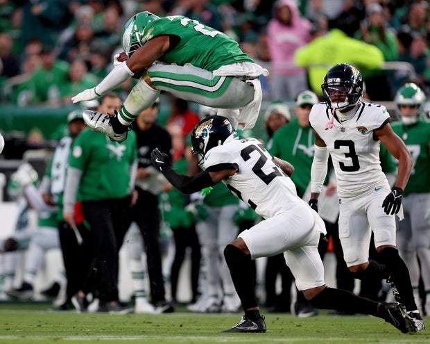 Saquon Barkley reverse hurdles over Jarrian Jones of the Jacksonville Jaguars in the second quarter at Lincoln Financial Field on Nov. 3, 2024 in Philadelphia.