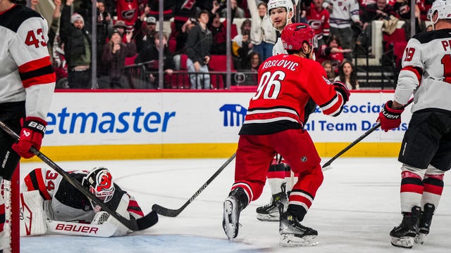 Jack Roslovic #96 of the Carolina Hurricanes celebrates after a goal during the third period against the New Jersey Devils at Lenovo Center on December 28, 2024 in Raleigh, North Carolina. 