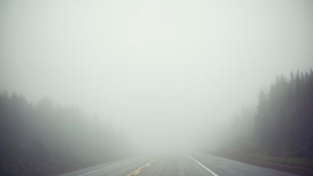 A road filled with fog 