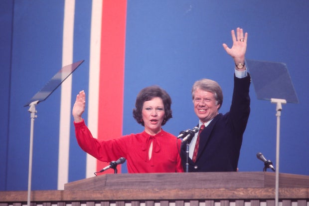 Jimmy & Rosalynn Carter Wave To The Crowd