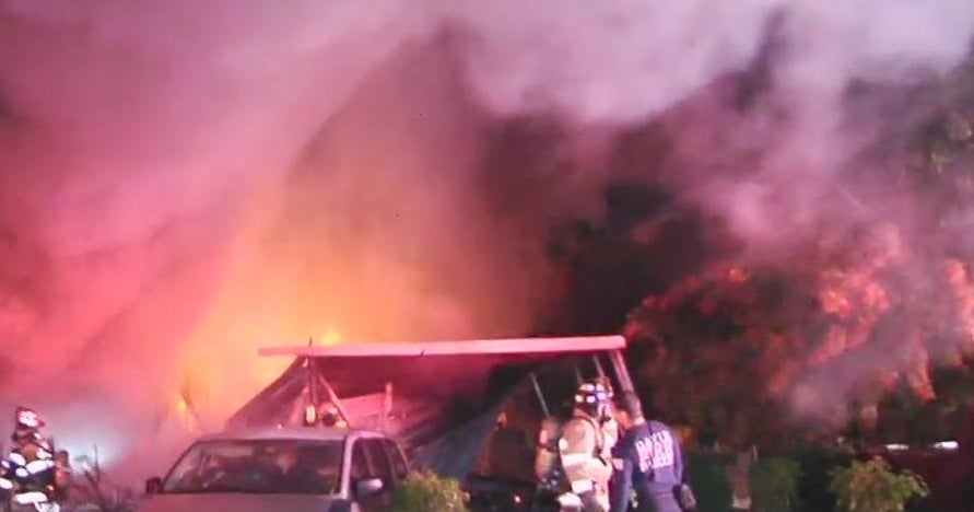 Massive fire destroys Davie mobile home