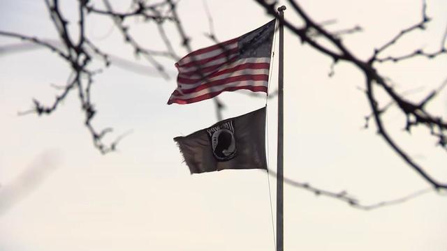 Flags fly at full staff outside a Nassau County building 