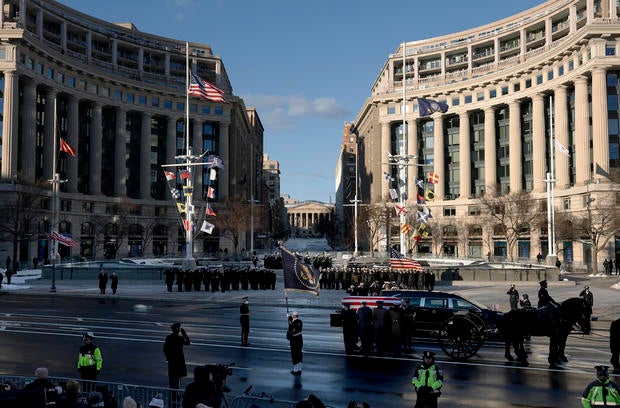 Funeral Procession Brings Body Of Former President Jimmy Carter To U.S. Capitol Building 