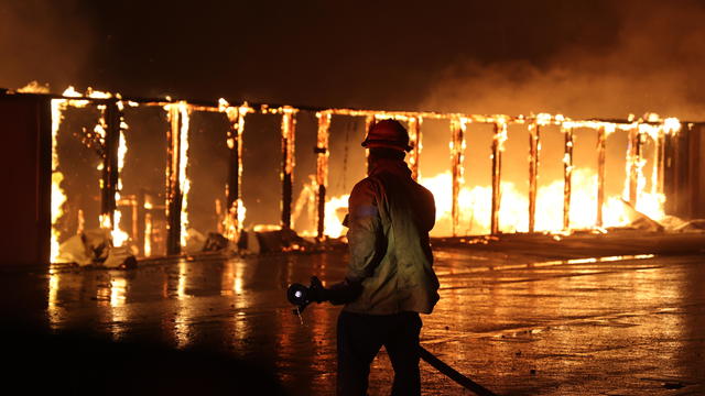 Firefighters continue battling Palisades fire in Los Angeles as flames rage out of control 