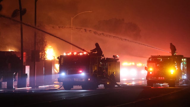 Firefighters continue battling Palisades fire in Los Angeles as flames rage out of control
