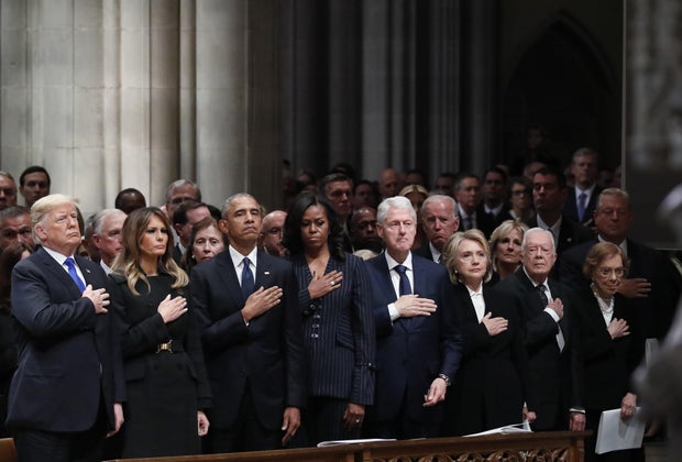 President Donald Trump, First Lady Melania Trump, former President Barack Obama, former First Lady Michelle Obama, former President Bill Clinton, former Secretary of State Hillary Clinton, former President Jimmy Carter and former First Lady Rosalynn Carter stand during a state funeral service . For former President George HW Bush at the National Cathedral in Washington, DC, US on Wednesday, December 5, 2018.