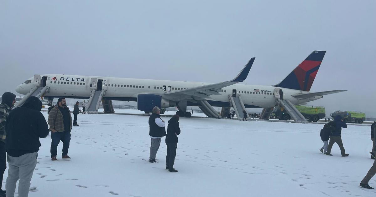 Delta flight aborts takeoff at Atlanta airport, forcing passengers to evacuate on slides; 4 injured